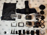 Action camera accessory kit with mounts, cases, lenses and suction cup, multiple parts