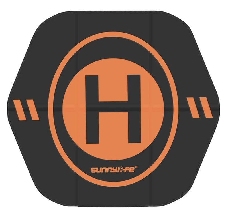 Black waterproof FPV drone top cover with orange circular logo