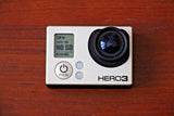 GoPro HERO3 action camera with large black lens and control buttons