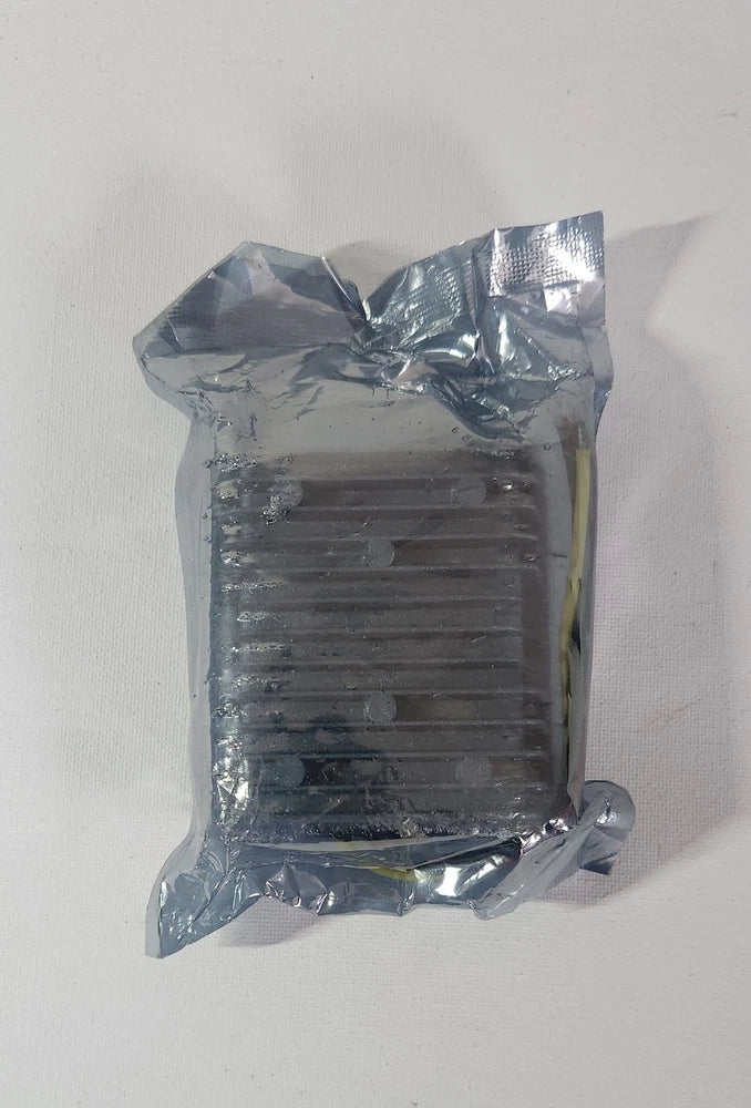 DC-DC converter module in silver foil wrap, rectangular heat sink and two wire leads