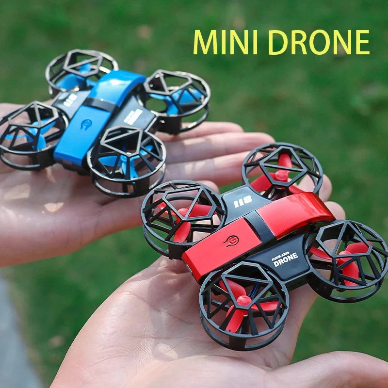 Mini RC quadcopter drone toy with dual cameras, red and blue prop guards in hand