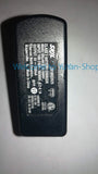Black battery charger with printed model and rating label on back