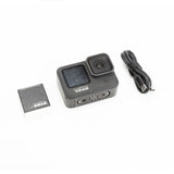GoPro HERO9 Black action camera with front lens, side screen, and USB cable
