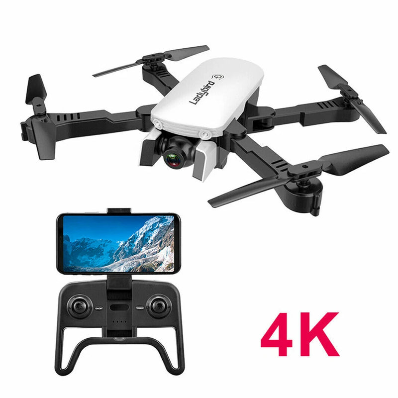 Black quadcopter drone with white camera module, plus handheld controller and 4K display