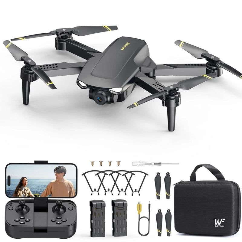 Foldable camera drone with four propellers and compact dark body, with batteries and carrying case