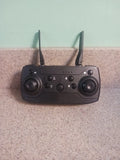 Black wireless handheld drone controller with dual antennas and dual joysticks