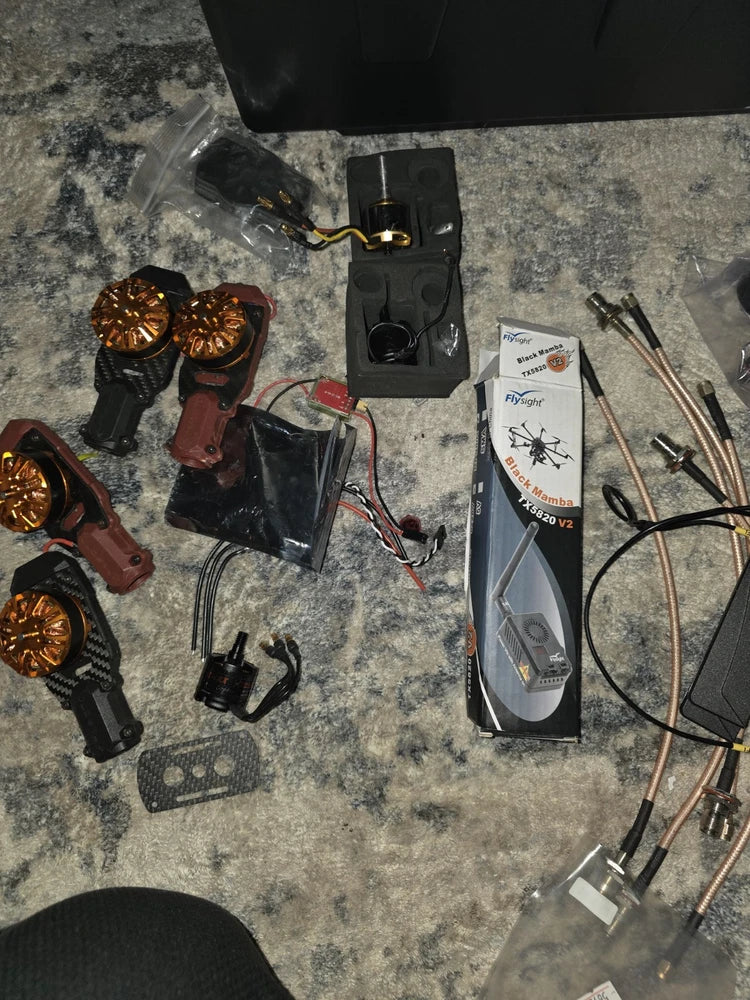 Drone parts kit with motors, circuit boards, and copper wiring cables