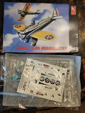 1:48 USMC P-26 Peashooter model kit with opened plastic parts and decals