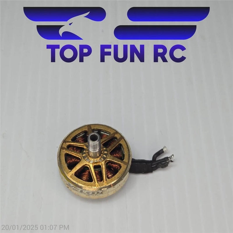 Brushless outrunner RC motor with gold housing, copper windings, shaft and wire leads