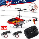 Red mini RC helicopter with black blades, star decals, and black remote controller with batteries