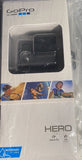 GoPro HERO action camera mount in original retail packaging, sealed clear plastic bag