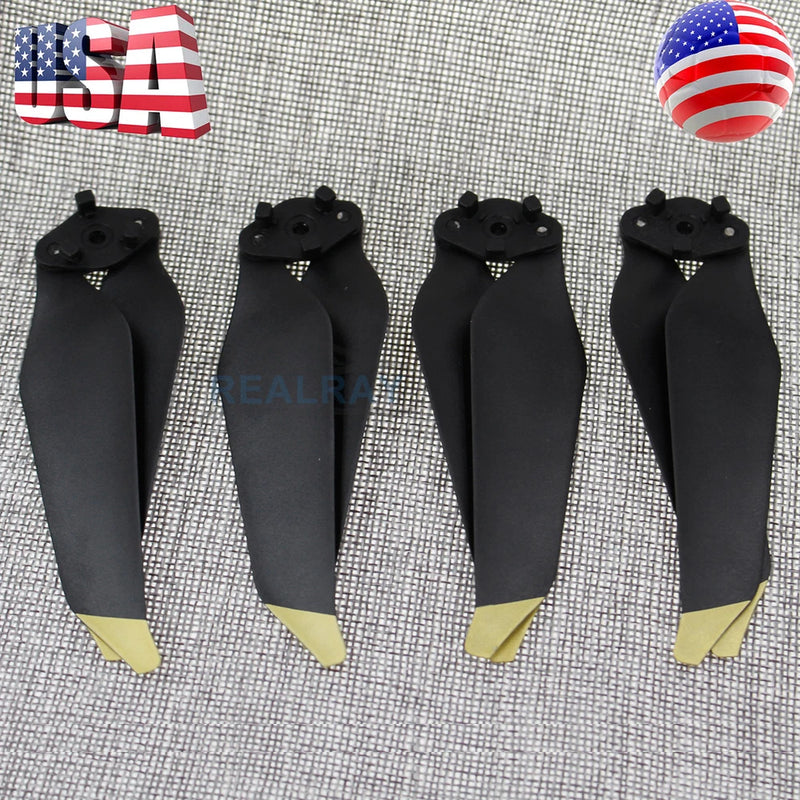 Set of four black drone propellers with gold tips and quick-release hubs