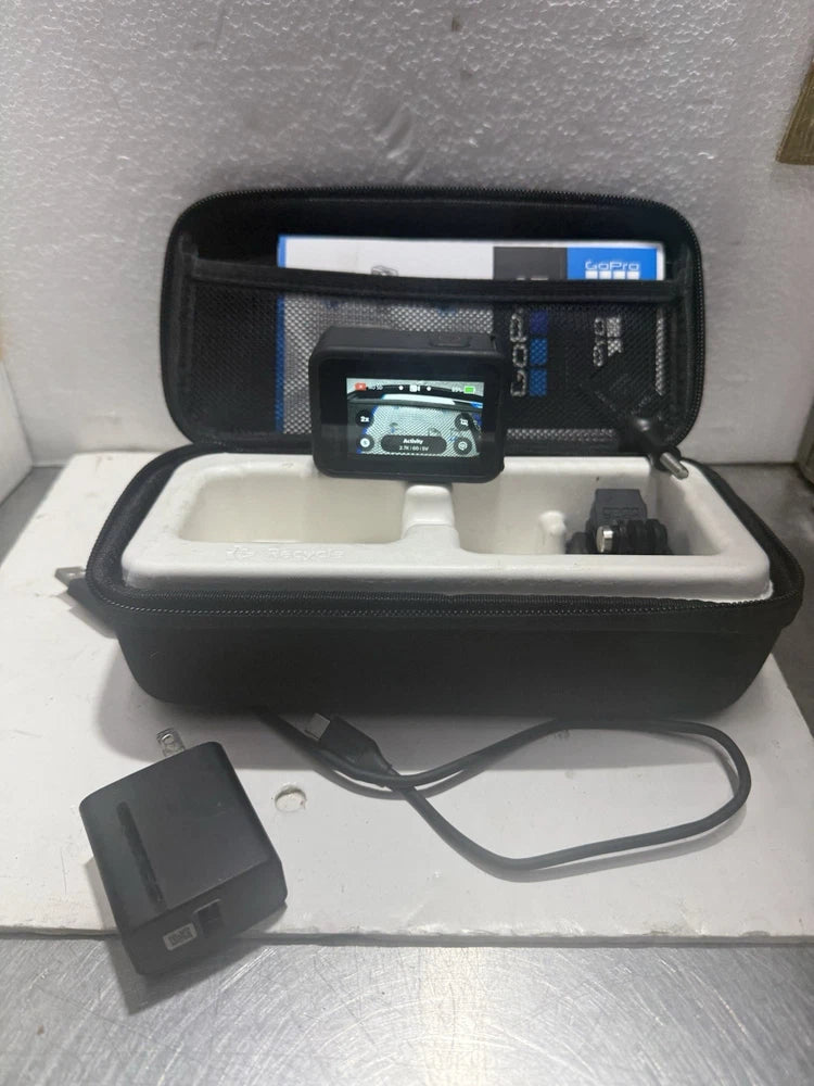 GoPro Hero 9 action camera kit with open black hard case and camera
