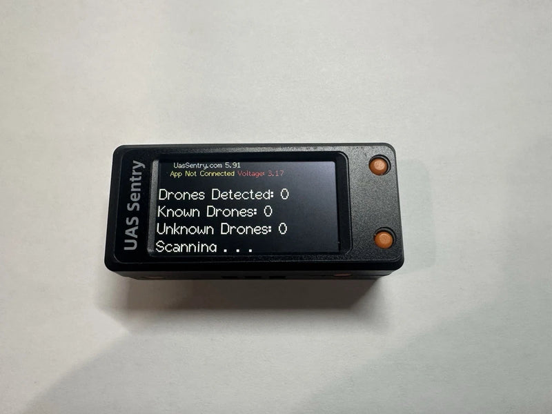 Portable UAS Sentry drone detection locator with LCD screen and orange side buttons