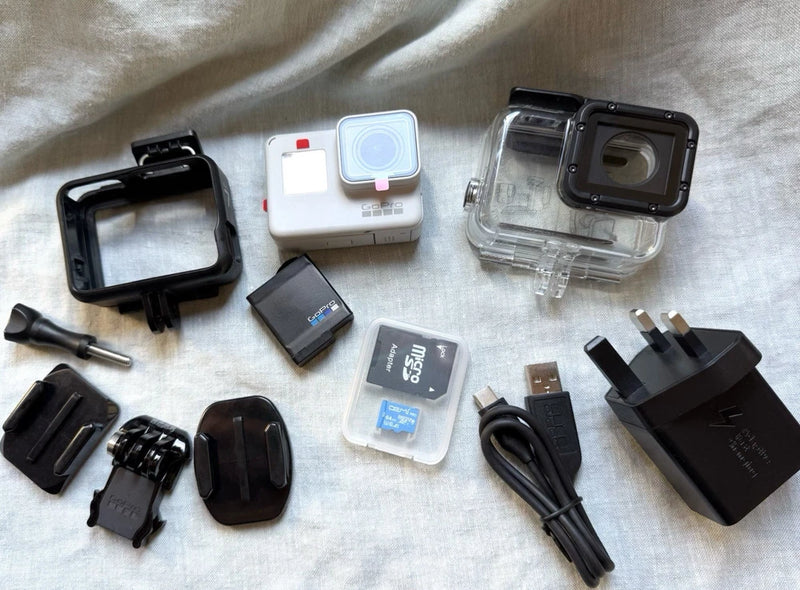 GoPro Hero7 Black action camera kit with dive housing, mounts, and charging accessories