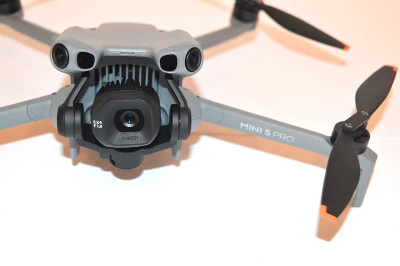 DJI Mini 5 Pro drone unit with front cameras and propellers