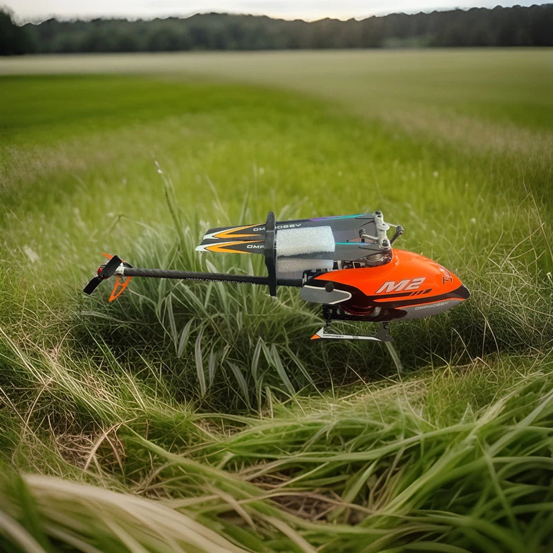 Orange and black RC helicopter with spinning rotor blades, ready for flight