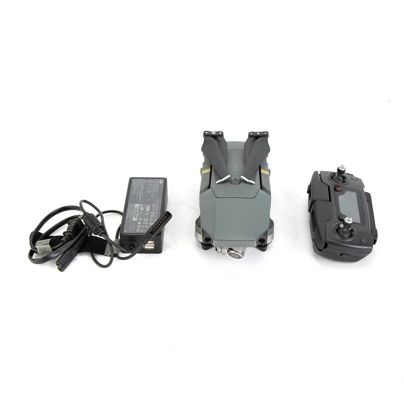 DJI Mavic Pro drone with remote controller, power adapter, and cables