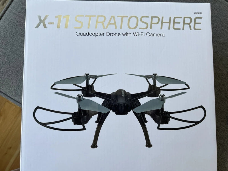 Black quadcopter drone with Wi‑Fi camera, front view