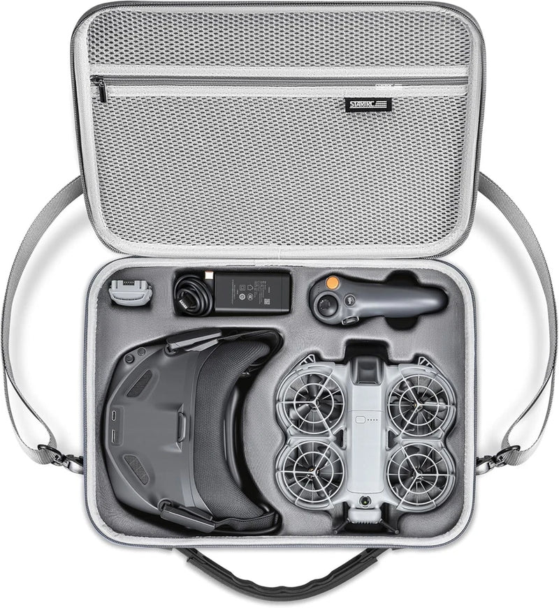 Open hard shell storage case with foam inserts for drone accessories
