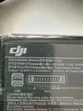 DJI battery charger AC adapter with input/output label and model F1C50 V1