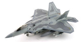 Grey camouflage model fighter jet in 3/4 view with twin tail fins