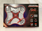 Quadcopter drone with video camera, red and gray, shown in retail box
