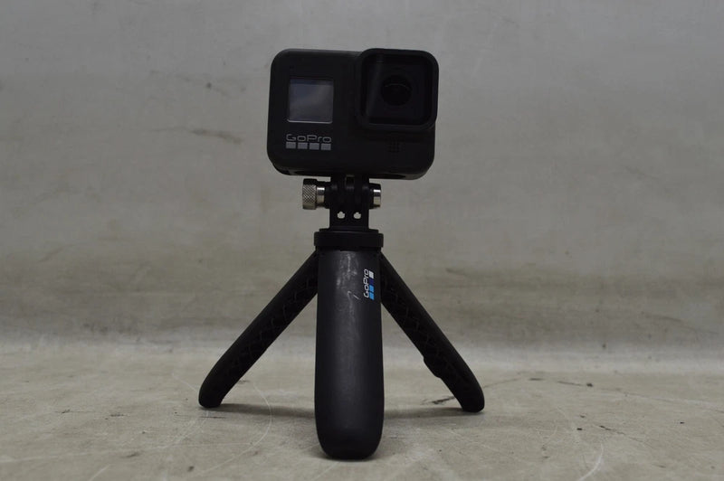 GoPro HERO8 Black action camera on small tabletop tripod with front screen