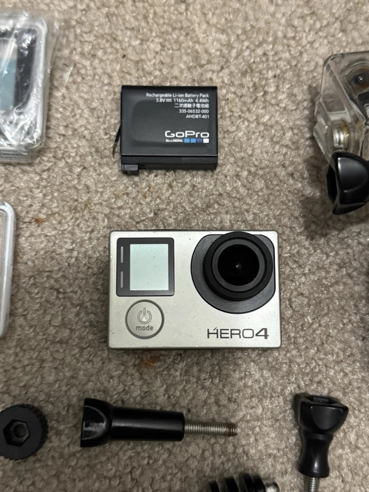 GoPro HERO4 silver action camera with touchscreen LCD and circular lens