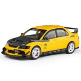 1:24 Mitsubishi Lancer EVO IX diecast toy car, yellow with black hood, front 3/4 view