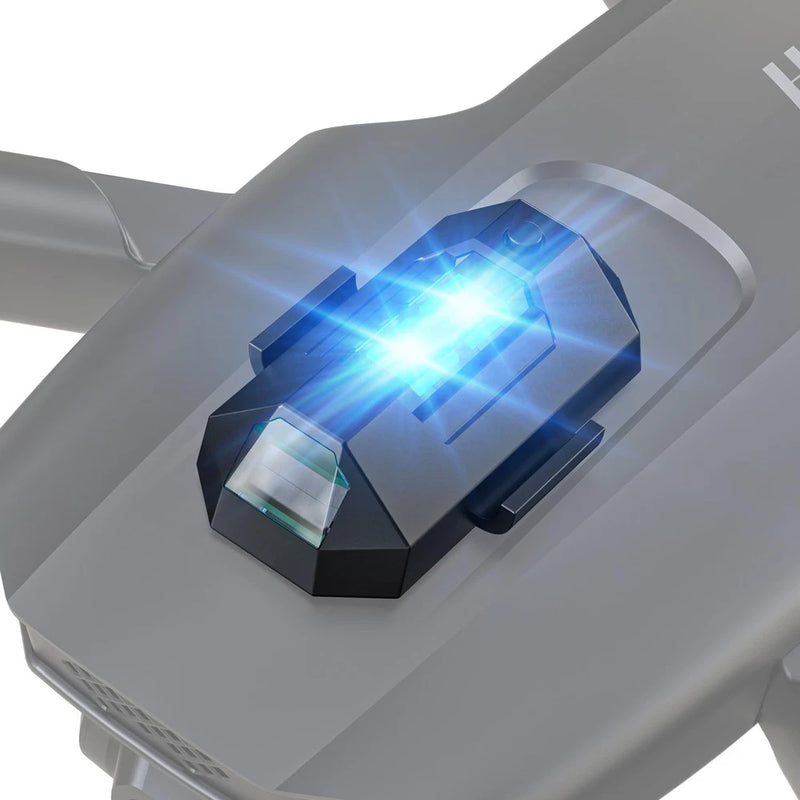 Drone strobe light on black mount, blue LED flash lens visible