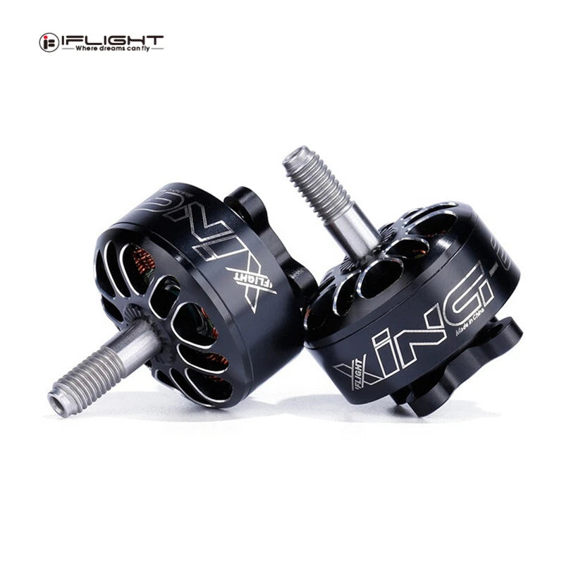 Black brushless RC drone motor pair with silver shafts and mounting holes