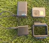 GoPro Hero 5 Black action camera with dual battery charger, two batteries and cables
