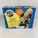 Pre-owned kid's battery-operated T-rex model kit box with wooden dinosaur parts
