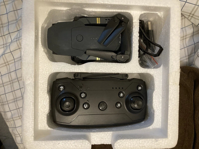 Emotion Drone 2.4 GHz remote controllers, black, with joysticks and buttons, in foam
