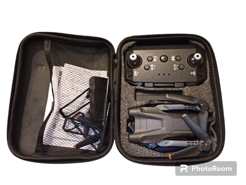 Hard-shell drone carrying case open, showing 4K drone, controller, and accessories