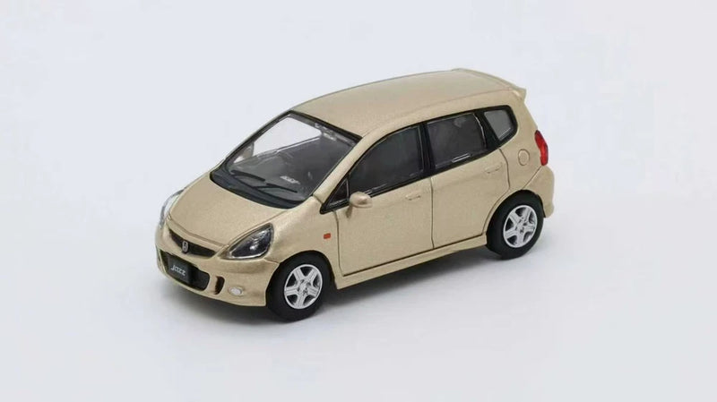 1:64 alloy hatchback car model in light beige, front three-quarter view