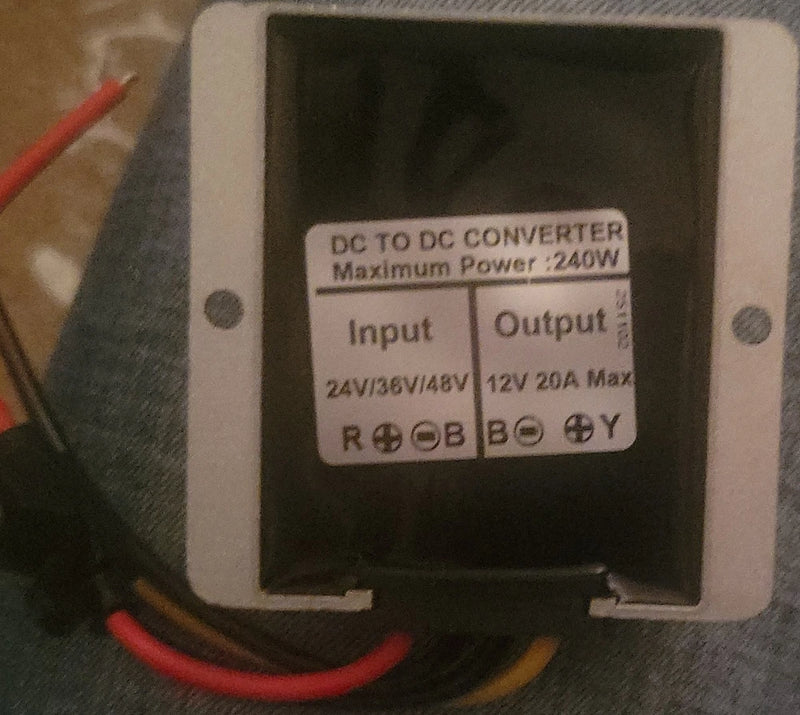 DC to DC converter module, black with front input/output label and terminal wires