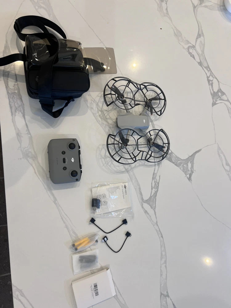 DJI Mini 2 SE drone with controller and propeller accessories