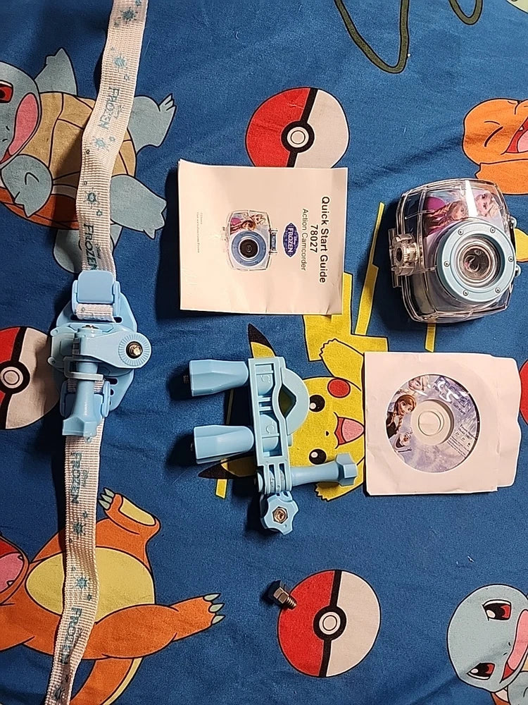 Disney Frozen action camcorder with clear lens and bundled accessories, on display.