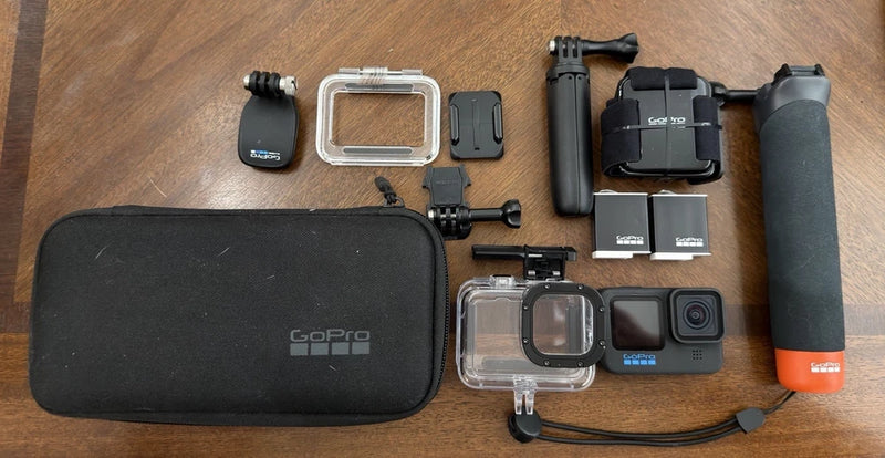 GoPro HERO11 Black action camera bundle with waterproof case, handle grip, and accessories