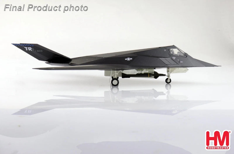 Dark gray F-117A Nighthawk model airplane with landing gear, side view on display