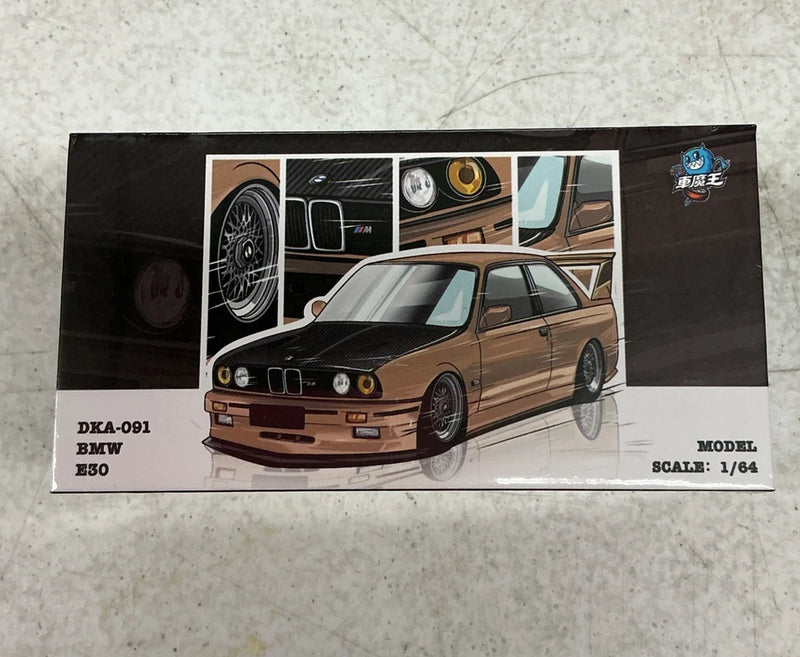 Brown BMW-style E30 die-cast model car in display box, 1:64 scale