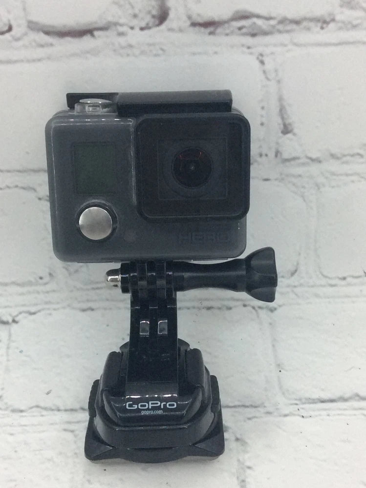 GoPro action camera in gray waterproof housing with mounting base and handle