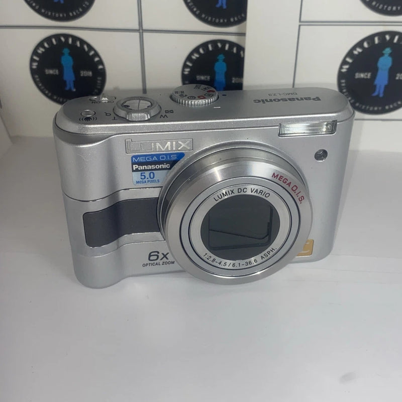 Silver Panasonic Lumix digital camera with 6x optical zoom lens and front grip