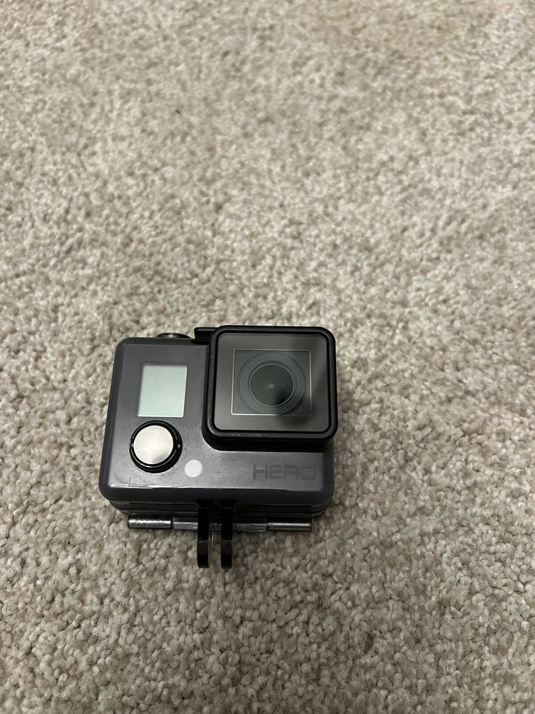 GoPro HERO action camera in black waterproof case with visible lens and front controls