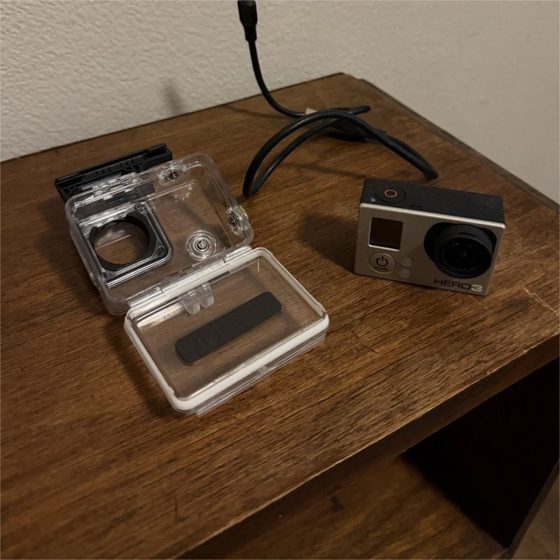 GoPro HERO3 action camera with waterproof housing, silver and black