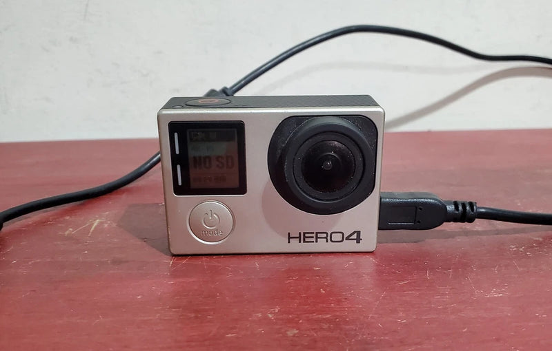 Silver GoPro HERO4 action camera with front lens and status screen