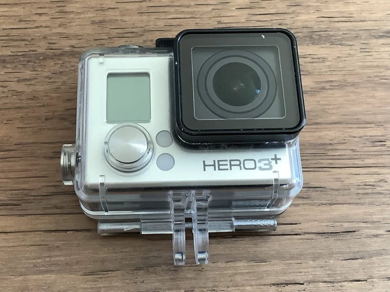 GoPro HERO3+ action camera in clear waterproof case, silver body and black lens