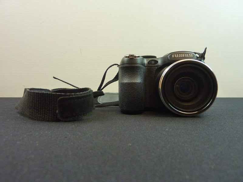 FujiFilm FinePix S2950 bridge camera in black with front lens and wrist strap